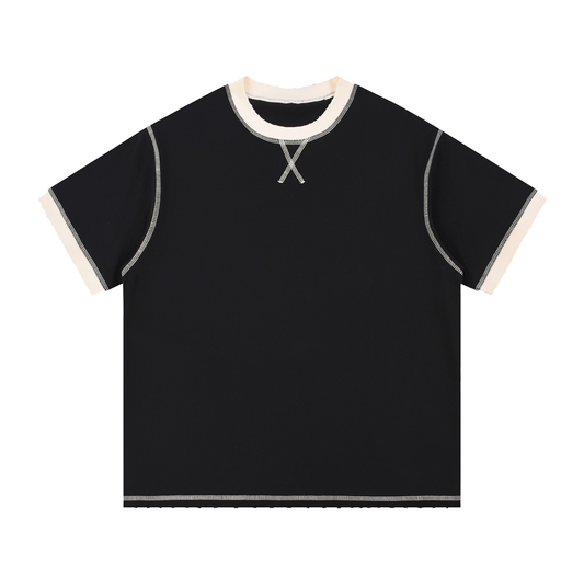 Model wearing Contrast-Stitched Cotton T-Shirt — drop-shoulder oversized cotton tee with sun-faded vintage wash. Australian streetwear by Vantage Heritage.