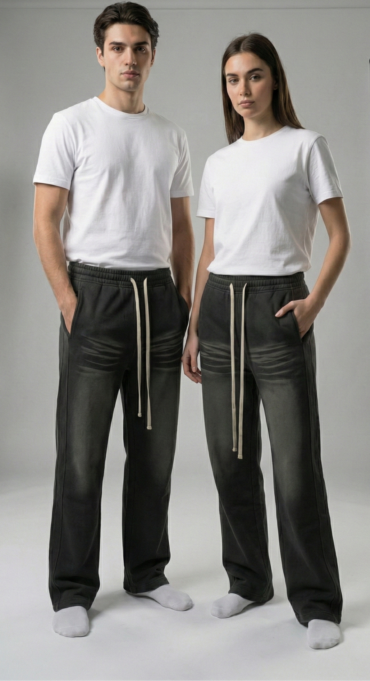 Model wearing Sunfade Curved Blade Fleece Sweatpants — vintage-washed baggy fit denim with raw hem. Australian streetwear by Vantage Heritage.